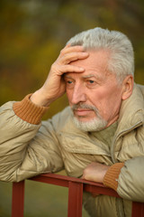 thoughtful senior man  in  park