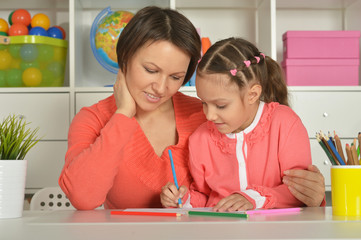 Sticker - Girl painting with mother