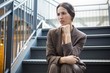 © WavebreakMediaMicro - Young businesswoman sitting on staircase