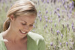 © Klaus Tiedge/Blend Images - Caucasian woman smiling in lavender field