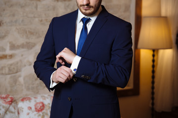 Wall Mural - Gentlemans hands with cufflinks