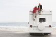© Klaus Tiedge/Blend Images - Mixed race Senior couple sitting on RV