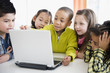 © JGI/Jamie Grill/Blend Images - Children using laptop together