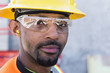 © Don Mason/Blend Images - Black worker smiling on construction site
