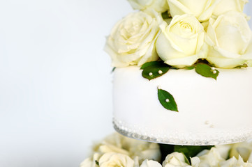 Wall Mural - Delicious white wedding cake decorated with flowers