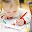 © MNStudio - Cute preschooler girl drawing a picture