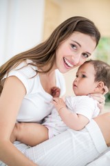 Wall Mural - Portrait of happy mother with baby 