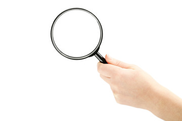 Female hand holding magnifying glass on a white background