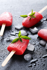 Poster - Watermelon popsicle on the black wooden table