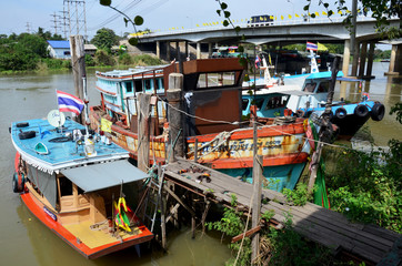 Barge and Tug Boat cargo ship stopping at dock in Chao Phraya ri