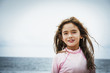 © Sollina Images/Blend Images - Asian girl near ocean