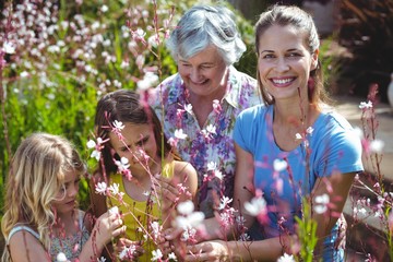 Wall Mural - Woman with senior woman and girls in back yard