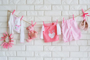 Baby clothes hanging on the wall as decoration of shooting location