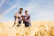 © Wavebreak Media - Two farmer using digital tablet in the field
