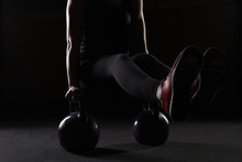 Young Woman Strength Training With Kettlebells In Gym