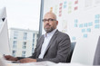 © Westend61 - Portrait of businessman working in office
