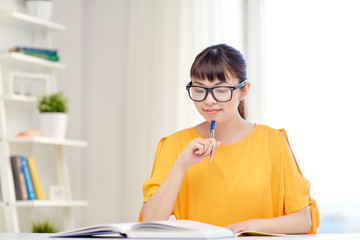 Poster - happy asian young woman student learning at home