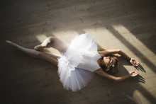 Ballerina In A Tutu Lying On The Floor