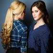 © cherry_d - Portrait of beautiful young twins women in a shirts and skirts and perfect make up and hair style