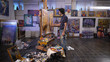 © kustvideo - In the process of creating a masterpiece. A professional artist working in his studio.