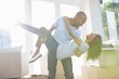 © Wavebreak Media - Young man lifting woman in his arms