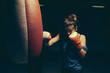 © Westend61 - Female boxer exercising at punch bag
