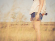 © kaipong - Girl standing in grass field with camera holding, vintage color