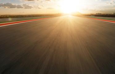 Wall Mural - Motion blurred racetrack,golden hour