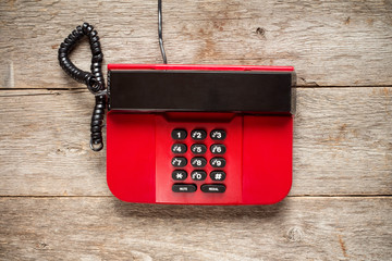 Top view of red vintage phone.