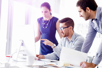 Wall Mural - Attractive office worker sitting at desk