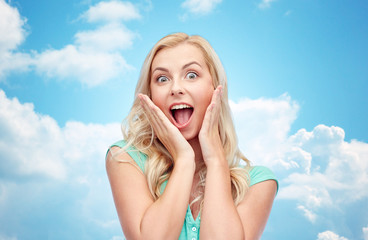 surprised smiling young woman or teenage girl