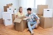 © Syda Productions - smiling couple with big boxes moving to new home
