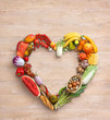 Heart symbol. Healthy eating concept. Food photography of heart made from different vegetables on old wooden table