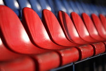 Red Chairs Bleachers In Stadium Close To