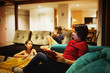 © Donald Iain Smith/Blend Images - Family relaxing together in living room