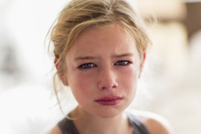 Close Up Of Red Face Of Crying Caucasian Girl