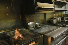 Flaming Grill In Restaurant Kitchen
