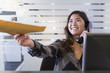 © Don Mason/Blend Images - Mixed race businesswoman handing folder in office