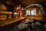 Fototapeta Tęcza - Middle aged couple in traditional wooden Finnish sauna