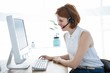 © WavebreakMediaMicro - grimacing hipster business woman looking at her computer