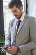 © Lumina Images/Blend Images - Caucasian businessman using cell phone