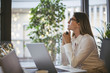 © Lumina Images/Blend Images - Caucasian businesswoman thinking at desk in office