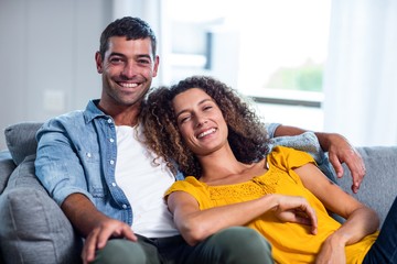 Wall Mural - Portrait of happy couple smiling