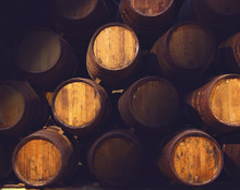 Row Of Wooden Barrels Of Tawny Portwine ( Port Wine ) In Cellar, Porto, Portugal. Vintage Old Style