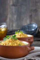 Wall Mural - Couscous with vegetables on wood
