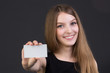 © stas_80 - young beautiful girl holding a business card in hand