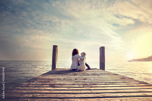 Foto-Tischdecke - woman embracing sweetly his dog while looking the view (von Cristina Conti)