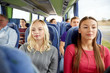 © Syda Productions - happy young women riding in travel bus