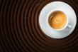 Cup of coffee on ground coffee - Tazza di caffè su caffè macinato