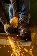 © idea_studio - Worker working of a grinding machine